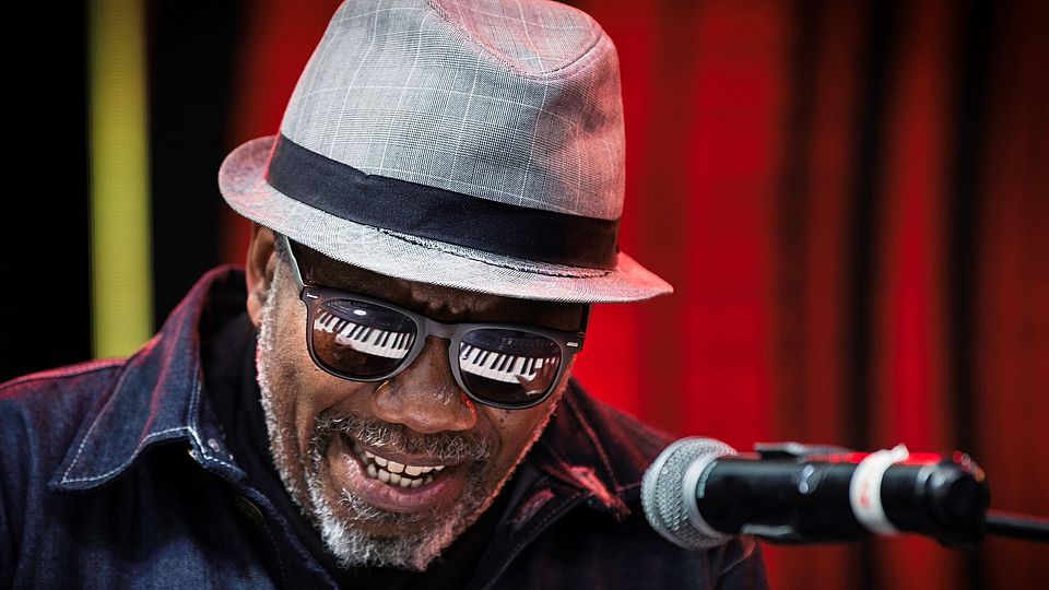 Portrait picture of pianist Andile Yenana by Bram Lammer