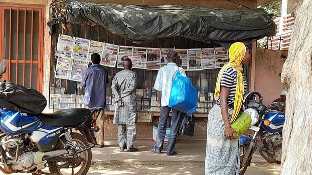 men reading newspapers