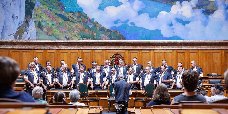 a choir performing at swiss parliament