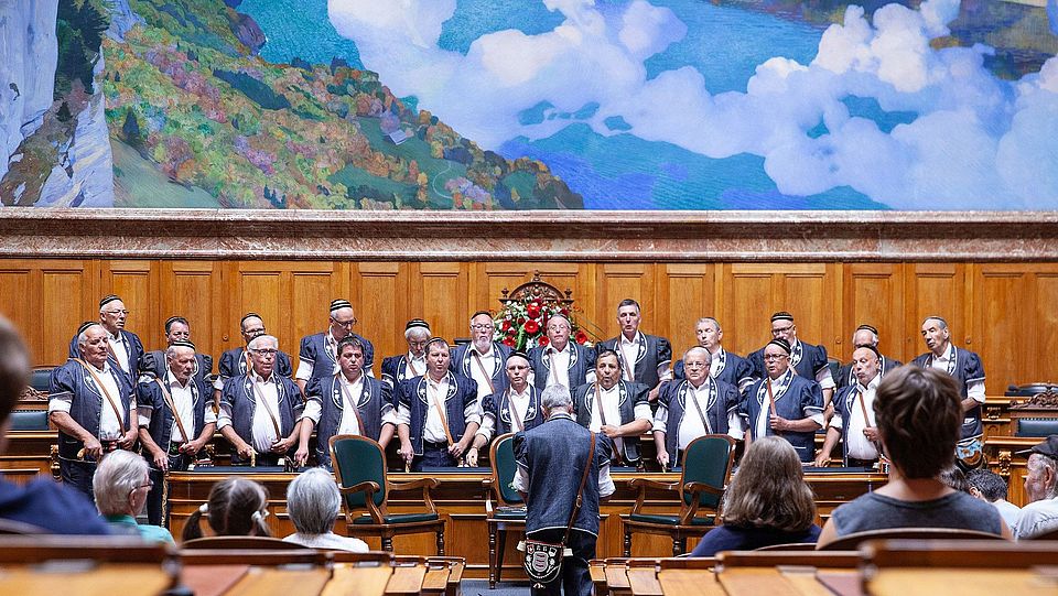 a choir performing at swiss parliament